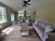 Spacious living room filled with natural light, comfortable sofas and a kitchen in the background at 214 Carolina Dr., Loris, SC 29569
