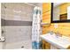Modern bathroom featuring a wood wall, a new vanity, and updated fixtures at 219 27Th Ave. N, North Myrtle Beach, SC 29582