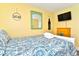 Comfortable bedroom featuring a queen bed, television, dresser and decorative wall hangings at 219 27Th Ave. N, North Myrtle Beach, SC 29582