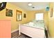 Cozy bedroom with a queen bed, light colored walls, light fixture and tropical themed decorations at 219 27Th Ave. N, North Myrtle Beach, SC 29582