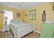 Cozy bedroom with a queen bed, light colored walls, light fixture and decorative wall hangings at 219 27Th Ave. N, North Myrtle Beach, SC 29582