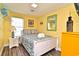 Bright bedroom showcasing modern decor, a comfortable queen bed, and a stylish accent wall at 219 27Th Ave. N, North Myrtle Beach, SC 29582