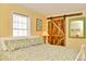 Charming bedroom with a decorative sliding barn door, bright window and comfortable queen bed at 219 27Th Ave. N, North Myrtle Beach, SC 29582
