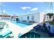 Stunning in-ground pool with various seating areas for a relaxing backyard experience at 219 27Th Ave. N, North Myrtle Beach, SC 29582