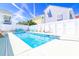 Inviting backyard pool surrounded by lounge chairs and benches; perfect for relaxation and enjoying the sun at 219 27Th Ave. N, North Myrtle Beach, SC 29582