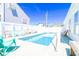 An inviting backyard pool surrounded by lounge chairs and benches, ideal for relaxing and soaking up the sun at 219 27Th Ave. N, North Myrtle Beach, SC 29582