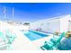 Inviting pool with lounge chairs and a bench in a beautiful fenced-in outdoor living space at 219 27Th Ave. N, North Myrtle Beach, SC 29582