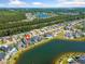 Drone shot showing a home near a lake in a residential community at 220 Waterfall Circle, Little River, SC 29566