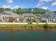 Water view of the home featuring a fenced backyard, and lush landscaping at 220 Waterfall Circle, Little River, SC 29566