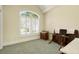 Bedroom has a neutral palette with plantation shutters, a vaulted ceiling, and furniture for added function at 220 Waterfall Circle, Little River, SC 29566