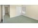 This spacious bedroom has neutral walls, a large closet, and a window providing natural light at 220 Waterfall Circle, Little River, SC 29566