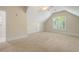 Spacious bedroom featuring vaulted ceilings, carpet flooring, neutral paint and a large window for natural light at 220 Waterfall Circle, Little River, SC 29566