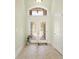 Elegant foyer with a decorative door with a transom window and tile flooring at 220 Waterfall Circle, Little River, SC 29566