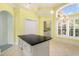 Kitchen area with an island, white cabinets, and stainless steel appliances at 220 Waterfall Circle, Little River, SC 29566
