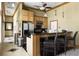 Kitchenette with stainless steel appliances, a breakfast bar, and a modern design at 220 Waterfall Circle, Little River, SC 29566