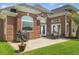 Brick home featuring a patio, Weber grill, outdoor furniture and views of the backyard at 220 Waterfall Circle, Little River, SC 29566