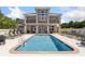 Luxury community pool with ample seating and well maintained exterior of the community clubhouse at 220 Waterfall Circle, Little River, SC 29566