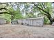 Backyard featuring storage sheds, mature shade trees, and a gravel surface at 2206 Beck St., Georgetown, SC 29440