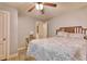 Cozy bedroom with patterned bedding, a ceiling fan, and a small side table at 2206 Beck St., Georgetown, SC 29440