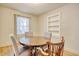 Bright dining room featuring hardwood floors and a rustic wood table with neutral cushioned chairs at 2206 Beck St., Georgetown, SC 29440