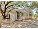 Home exterior with a stone driveway, covered entry, and a mix of gravel and grassy areas at 2206 Beck St., Georgetown, SC 29440