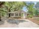 Charming home with mature trees, stone driveway, and well-maintained landscaping at 2206 Beck St., Georgetown, SC 29440