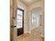 Bright foyer with an open door, hardwood floors, and an arched doorway to a naturally lit room at 2206 Beck St., Georgetown, SC 29440