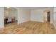Open living room with hardwood flooring, decorative archways, and a view into the dining area at 2206 Beck St., Georgetown, SC 29440