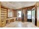Living room with built-in shelves, a desk, and an exterior door at 2206 Beck St., Georgetown, SC 29440