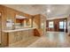 Spacious living room featuring wood-paneled walls with the kitchen visible through an opening at 2206 Beck St., Georgetown, SC 29440