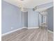 View of an empty living room showing decorative lighting and hard wood floors at 2258 Essex Dr. # G, Surfside Beach, SC 29575