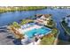 Gorgeous pool area featuring a pool house with plenty of seating and a lake in the background at 2258 Essex Dr. # G, Surfside Beach, SC 29575