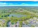 Aerial view of lake, townhouses, and a highway in the distance at 2312 Sweetwater Blvd. # 2312, Murrells Inlet, SC 29576
