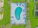 Aerial view of a kidney-shaped pool surrounded by chairs and manicured landscaping at 2312 Sweetwater Blvd. # 2312, Murrells Inlet, SC 29576