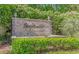 Community entrance sign with stone accents and lush landscaping at 2312 Sweetwater Blvd. # 2312, Murrells Inlet, SC 29576
