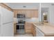Bright kitchen featuring wooden cabinets and modern appliances at 2312 Sweetwater Blvd. # 2312, Murrells Inlet, SC 29576