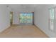 Bright living room with a sliding door to a covered lanai at 2312 Sweetwater Blvd. # 2312, Murrells Inlet, SC 29576