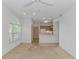 Living room with arched window and breakfast bar looking into the kitchen at 2312 Sweetwater Blvd. # 2312, Murrells Inlet, SC 29576