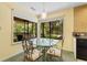 Cozy dining area with a glass table set and natural light at 234 Westleton Dr. # 21-C, Myrtle Beach, SC 29572