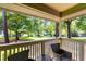Covered patio with comfortable seating overlooking a lush green lawn at 234 Westleton Dr. # 21-C, Myrtle Beach, SC 29572