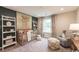 Charming Bedroom with a crib, soft lighting, and a window view at 2425 Watershed Way, Longs, SC 29568