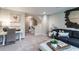 Inviting loft area featuring modern décor, comfortable seating, and natural light at 2425 Watershed Way, Longs, SC 29568