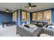 Inviting outdoor patio area complete with comfortable seating, ceiling fans, and ample space for entertaining at 2517 Watershed Way, Longs, SC 29568