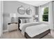 Serene bedroom with neutral tones, a large window with lots of light, and stylish decor at 2525 Watershed Way, Longs, SC 29568