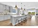 Spacious kitchen featuring a large center island with seating, stainless steel appliances, and open layout at 2525 Watershed Way, Longs, SC 29568