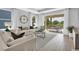Bright and airy living room with a sliding glass door leading to an outdoor patio and seating area at 2525 Watershed Way, Longs, SC 29568