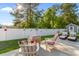 Patio with lounge chairs, a grill, and a white privacy fence at 263 Lakota Loop, Longs, SC 29568