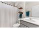 Bathroom with shower, toilet, vanity, mirror and floating shelves with decor at 263 Lakota Loop, Longs, SC 29568