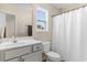 Bright bathroom features a sink, toilet, shower and a window at 263 Lakota Loop, Longs, SC 29568