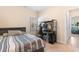 Bedroom with a twin bed, carpet, modern desk and chair, and a window at 263 Lakota Loop, Longs, SC 29568
